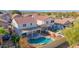 Aerial view of backyard featuring a pool, covered patio, desert landscaping, and lush greenery at 914 E Ross Ave, Phoenix, AZ 85024