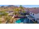 Relaxing pool area with desert landscaping, string lights, and covered patio for outdoor entertaining at 914 E Ross Ave, Phoenix, AZ 85024