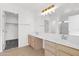 Bathroom featuring a large mirror, double sinks, and ample counter space with under-sink storage at 914 E Ross Ave, Phoenix, AZ 85024