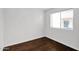 Cozy bedroom with wood flooring and a window at 914 E Ross Ave, Phoenix, AZ 85024