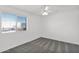 Well-lit bedroom with a ceiling fan, neutral carpet, and large window providing ample natural light at 914 E Ross Ave, Phoenix, AZ 85024