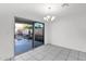 Bright dining area with tile flooring and sliding glass doors to the backyard pool at 914 E Ross Ave, Phoenix, AZ 85024