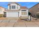 Two-story home featuring a red tile roof, neutral stucco, and a two car garage at 914 E Ross Ave, Phoenix, AZ 85024