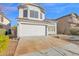 Exterior shot of a two-story home with a red tile roof, garage, and xeriscaped front yard at 914 E Ross Ave, Phoenix, AZ 85024