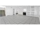 View of the home's living area featuring tile floors, a fireplace, and a staircase at 914 E Ross Ave, Phoenix, AZ 85024