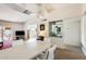 Bright dining area with built-in shelving and view to living room at 10807 N Fairway W Ct # 212, Sun City, AZ 85351