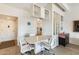 Dining area with built-in shelving and adjacent kitchen view at 10807 N Fairway W Ct # 212, Sun City, AZ 85351