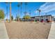 Condo building with palm trees and desert landscaping at 10807 N Fairway W Ct # 212, Sun City, AZ 85351