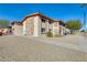 Condo building showcasing stone exterior and walkway at 10807 N Fairway W Ct # 212, Sun City, AZ 85351