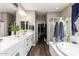 Spa-like bathroom with double sinks, large tub, and shower at 1081 W Danish Red Trl, San Tan Valley, AZ 85143