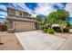 Two-story house with a two-car garage and landscaped yard at 1081 W Danish Red Trl, San Tan Valley, AZ 85143