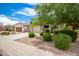 Two-story house with a two-car garage and landscaped yard at 1081 W Danish Red Trl, San Tan Valley, AZ 85143