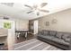 Bright game room with a couch, air hockey table, and ceiling fan at 1081 W Danish Red Trl, San Tan Valley, AZ 85143