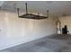 Garage interior with overhead storage and floor mat at 1081 W Danish Red Trl, San Tan Valley, AZ 85143