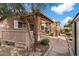 Landscaped backyard with pathway and wooden fence at 1107 E Lakeview Dr, San Tan Valley, AZ 85143