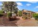 Landscaped backyard with storage shed and trees at 1107 E Lakeview Dr, San Tan Valley, AZ 85143