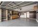 Bright garage with built-in shelving, workbench, and washer/dryer hookups at 1107 E Lakeview Dr, San Tan Valley, AZ 85143