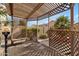 Wooden pergola with lattice sides, providing shade at 1107 E Lakeview Dr, San Tan Valley, AZ 85143