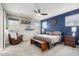 Spacious bedroom with blue accent wall and king-size bed at 1110 S Jay St, Chandler, AZ 85286