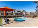 Community features a refreshing pool with chairs and an umbrella for shade at 1110 S Jay St, Chandler, AZ 85286