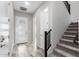 Bright entryway with tile flooring, modern door, and staircase at 1110 S Jay St, Chandler, AZ 85286