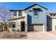 Two-story home with blue siding, neutral accents, and a two-car garage at 1110 S Jay St, Chandler, AZ 85286