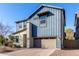 Two-story home with blue siding, neutral accents, and a two-car garage at 1110 S Jay St, Chandler, AZ 85286