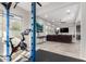 Bright home gym with Peloton bike and weight rack at 1110 S Jay St, Chandler, AZ 85286