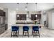 Modern kitchen with granite countertops and blue barstools at 1110 S Jay St, Chandler, AZ 85286