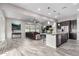 Open concept kitchen with island, dark cabinetry, and granite counters at 1110 S Jay St, Chandler, AZ 85286