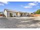 Expansive backyard featuring a covered patio, perfect for enjoying the outdoors and entertaining guests at 1242 E Bartlett Way, Chandler, AZ 85249