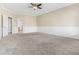 Spacious bedroom featuring neutral carpet, wainscoting, and large closet providing ample storage at 1242 E Bartlett Way, Chandler, AZ 85249