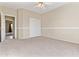 Spacious bedroom with neutral carpet, ceiling fan, and large closet providing ample storage at 1242 E Bartlett Way, Chandler, AZ 85249