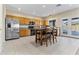 Modern kitchen featuring stainless steel appliances, wood cabinets, and a casual dining area at 1242 E Bartlett Way, Chandler, AZ 85249