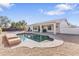 Inviting pool with tanning ledge set against a covered patio and backyard, perfect for outdoor living at 1242 E Bartlett Way, Chandler, AZ 85249