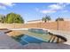 Refreshing pool with a tanning ledge and brick perimeter walls, offering a private backyard oasis at 1242 E Bartlett Way, Chandler, AZ 85249