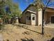 Landscaped backyard with mature trees and a patio at 1244 S Portland Ave, Gilbert, AZ 85296