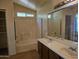 Updated bathroom with double sinks and a bathtub at 1244 S Portland Ave, Gilbert, AZ 85296