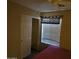 Bedroom with a closet, window, and ceiling fan at 1244 S Portland Ave, Gilbert, AZ 85296