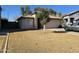 Tan house with tile roof, two-car garage, and front yard at 1244 S Portland Ave, Gilbert, AZ 85296