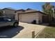 Home exterior with two-car garage and driveway at 1244 S Portland Ave, Gilbert, AZ 85296