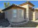 Tan house with tile roof, bay window, and landscaping at 1244 S Portland Ave, Gilbert, AZ 85296