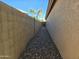 Side yard access with gravel pathway at 1244 S Portland Ave, Gilbert, AZ 85296