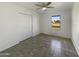 Simple bedroom with double door closet and tile flooring at 130 N 95Th Pl, Mesa, AZ 85207