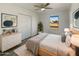 Cozy bedroom with ample closet space and large window at 130 N 95Th Pl, Mesa, AZ 85207