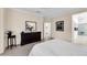 Bedroom with dresser, ensuite access, and large mirror at 15506 W Skyview Way, Surprise, AZ 85374