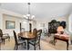 Formal dining room with chandelier and hardwood furniture at 15506 W Skyview Way, Surprise, AZ 85374