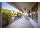 Covered patio with seating area and desert landscaping at 15506 W Skyview Way, Surprise, AZ 85374