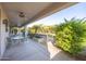 Covered patio with seating area and desert landscaping at 15506 W Skyview Way, Surprise, AZ 85374