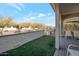 Artificial turf backyard with covered patio and seating area at 16914 W Merrell St, Goodyear, AZ 85395